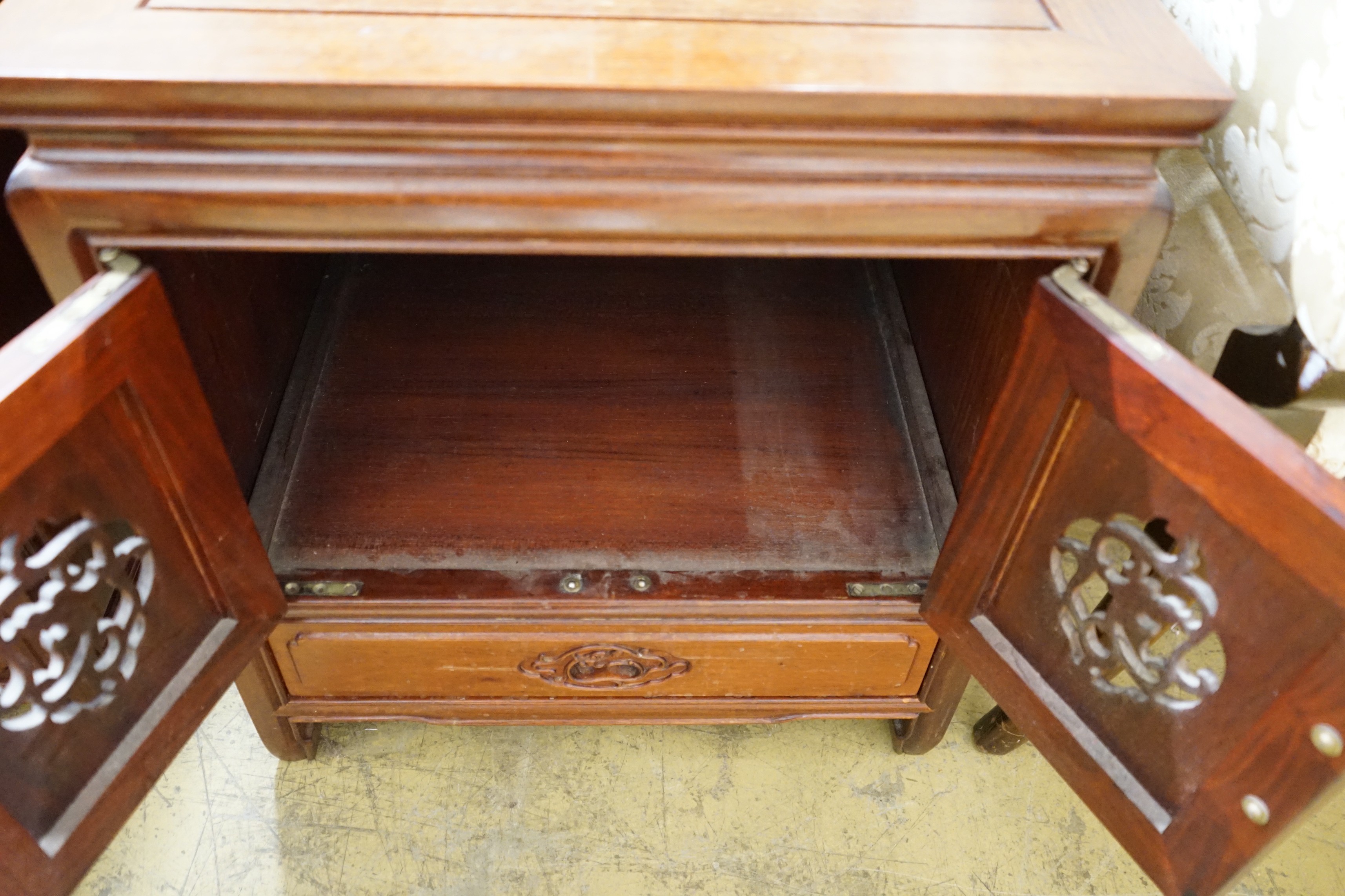 A pair of Chinese carved padouk bedside cabinets, width 51cm, depth 51cm, height 56cm